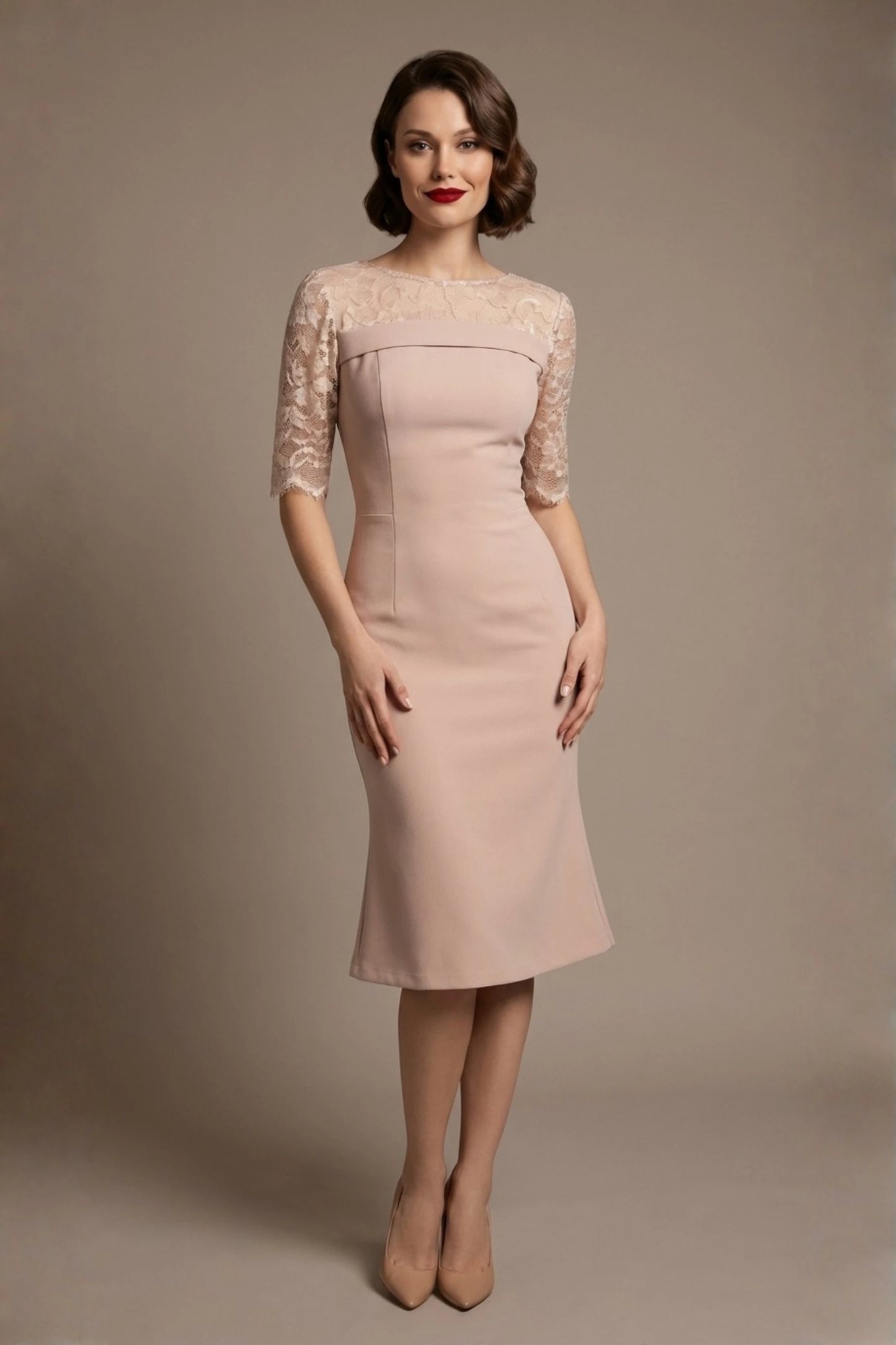 Woman wearing a diva catwalk Francesca Lace Fluted Dress in pink haze colour dress with lace sleeves against a brown background front view (Pink Haze)