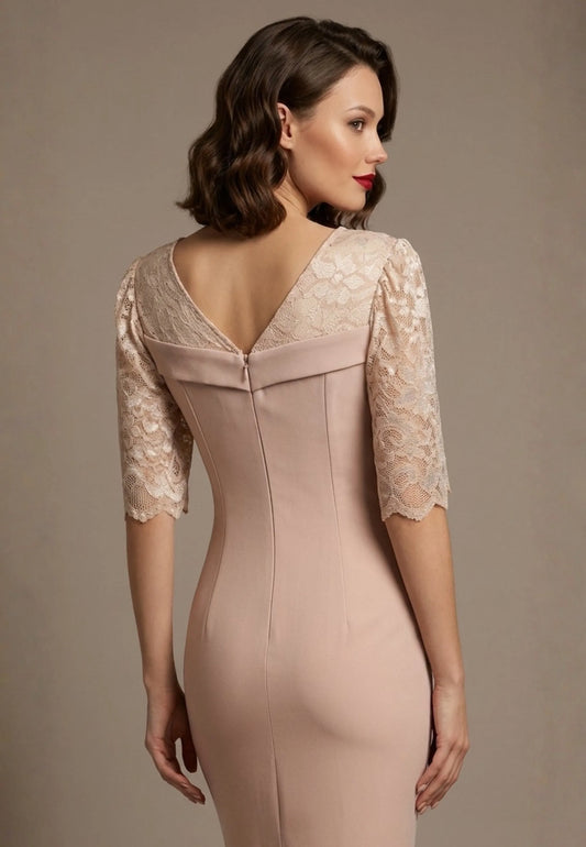 Woman wearing a diva catwalk Francesca Lace Fluted Dress in pink haze colour dress with lace sleeves against a brown background back close up view (Pink Haze)