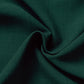 Close-up of dark green fabric with folds