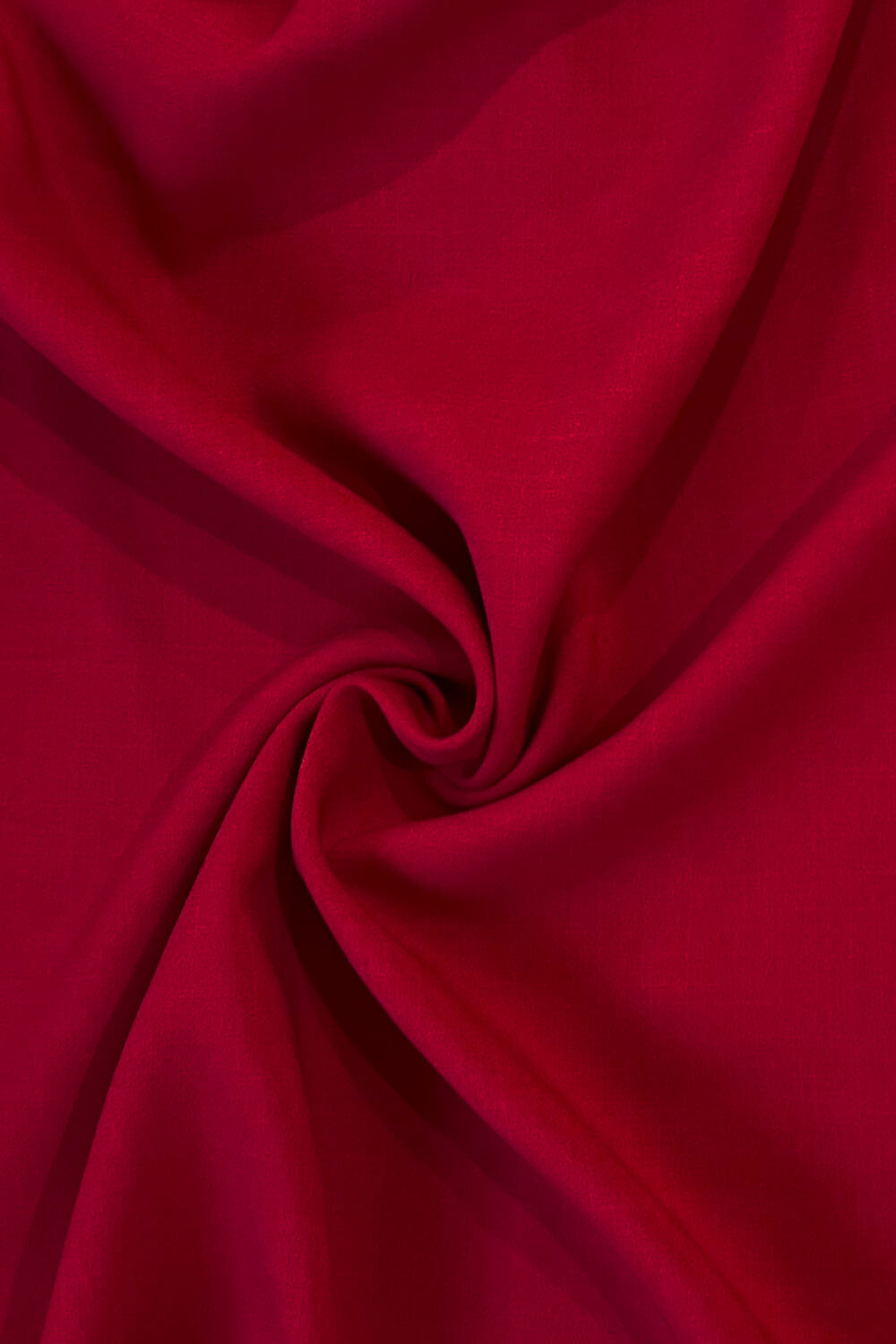 Close-up of red fabric with a swirl pattern